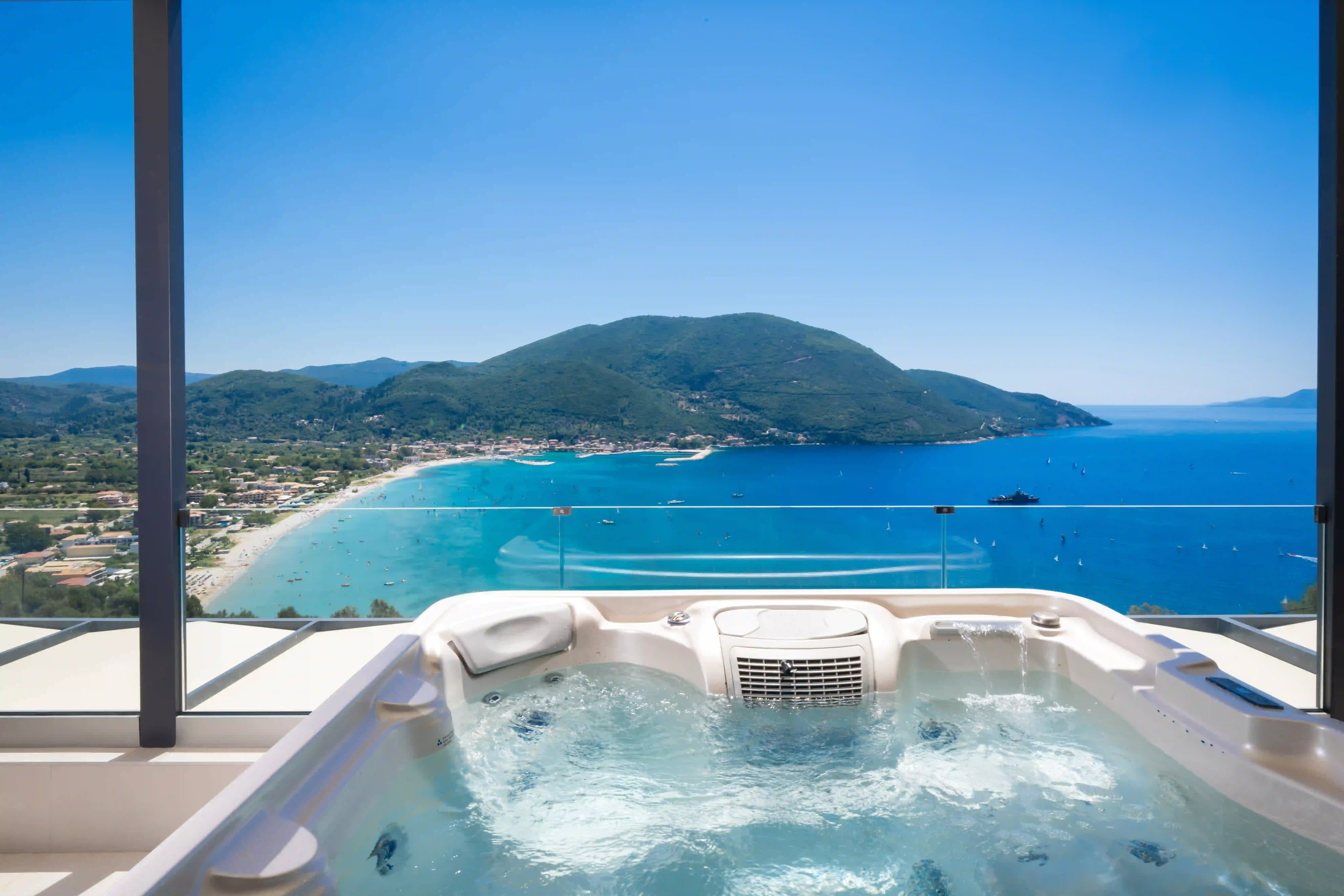 Hot tub with panoramic Vasiliki Bay view at Azzura Villas
