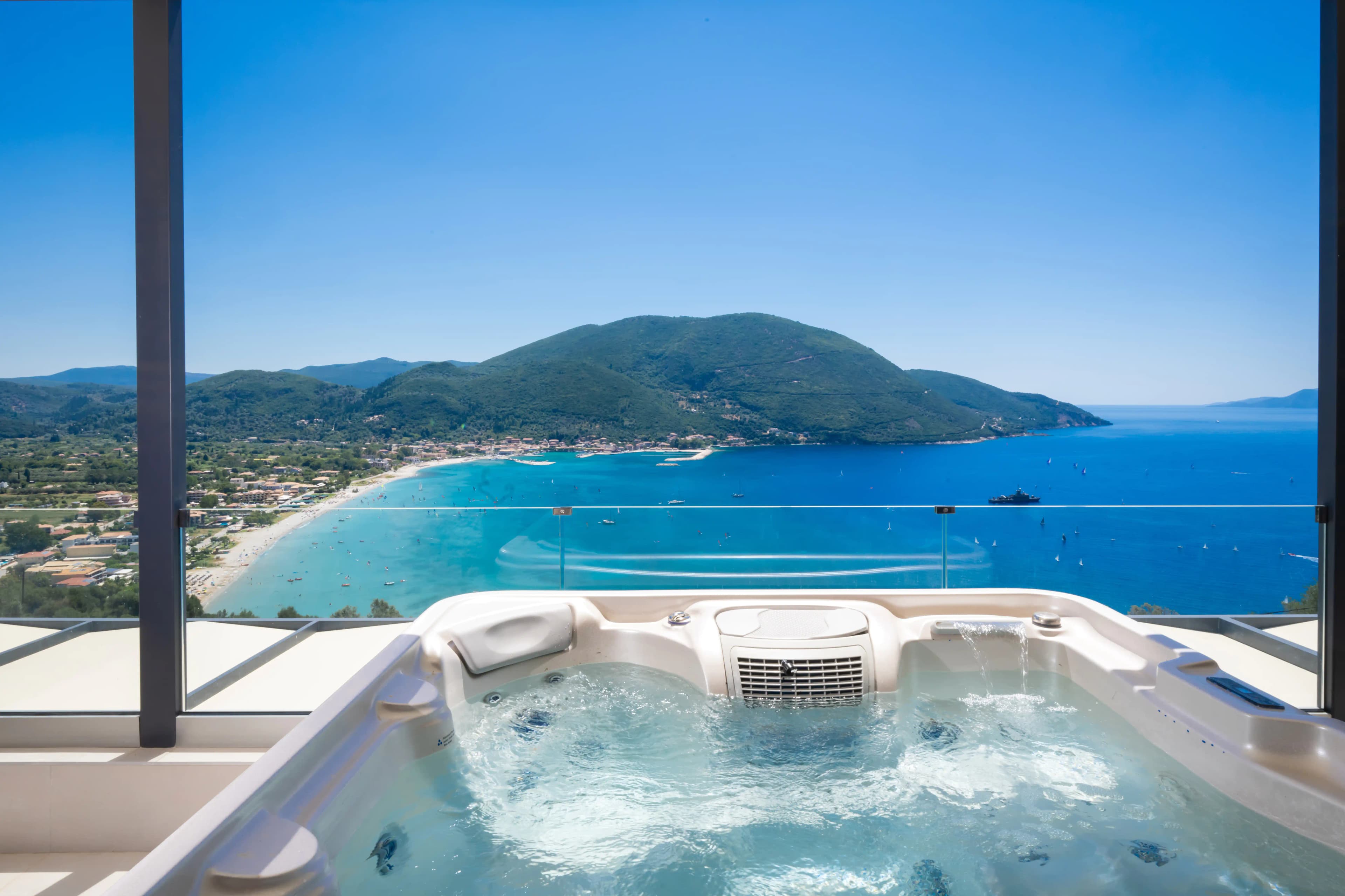 Hot tub with panoramic Vasiliki Bay view at Azzura Villas