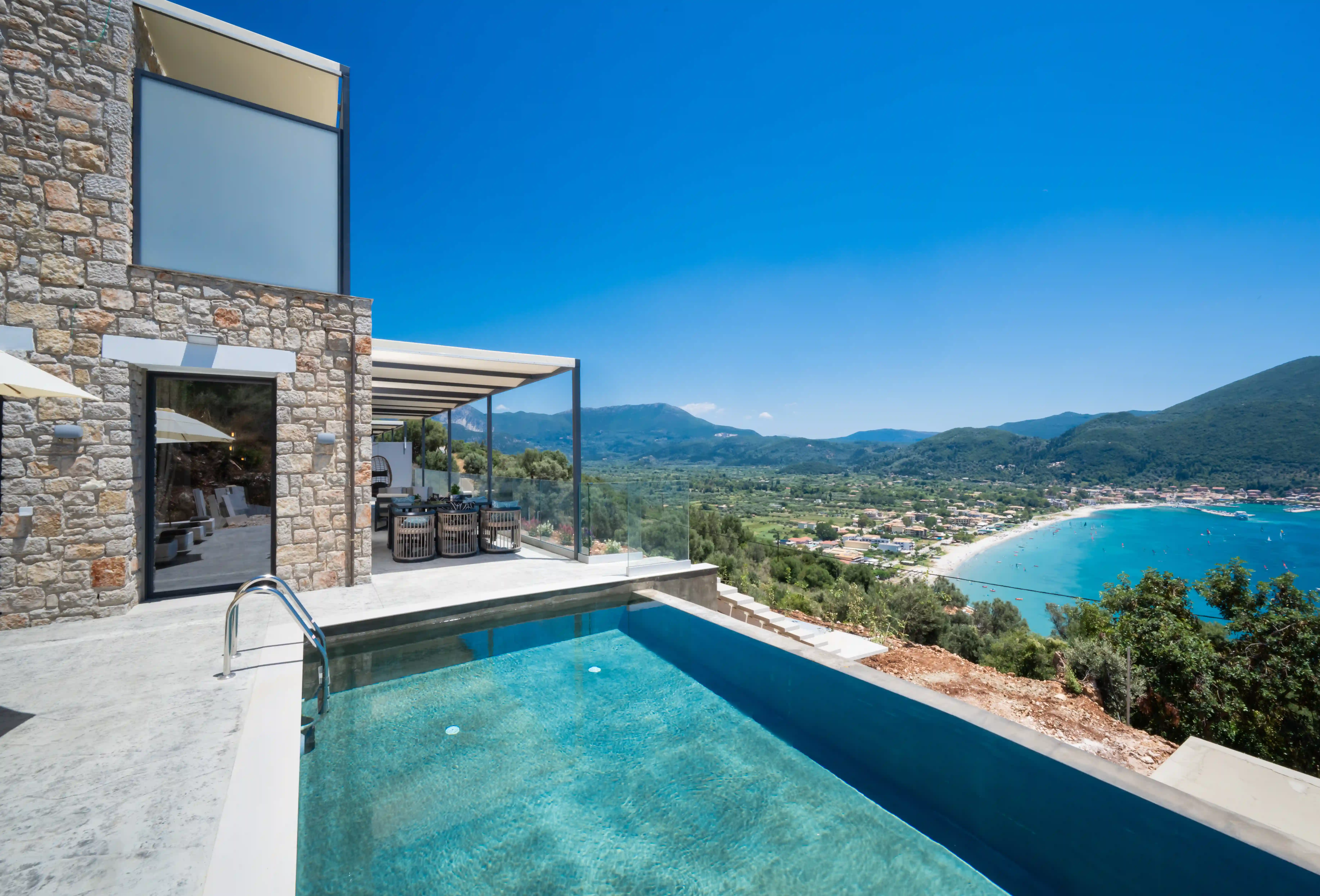 Infinity pool with mountain backdrop at Azzura Villas